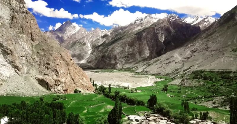 Stone and earth homes surrounded by fields in Askole village, Baltistan